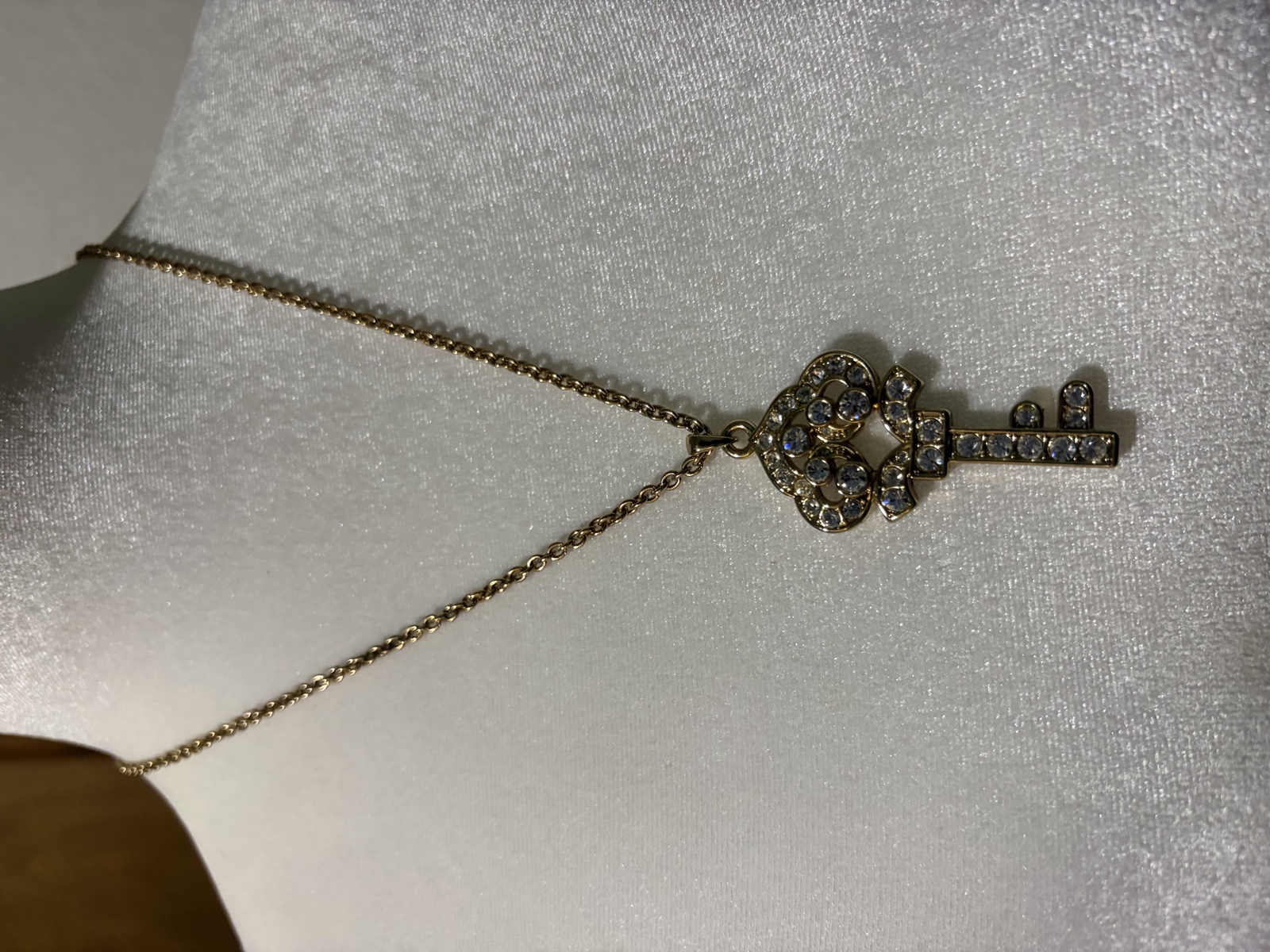 Gold-tone rhinestone key pendant necklace